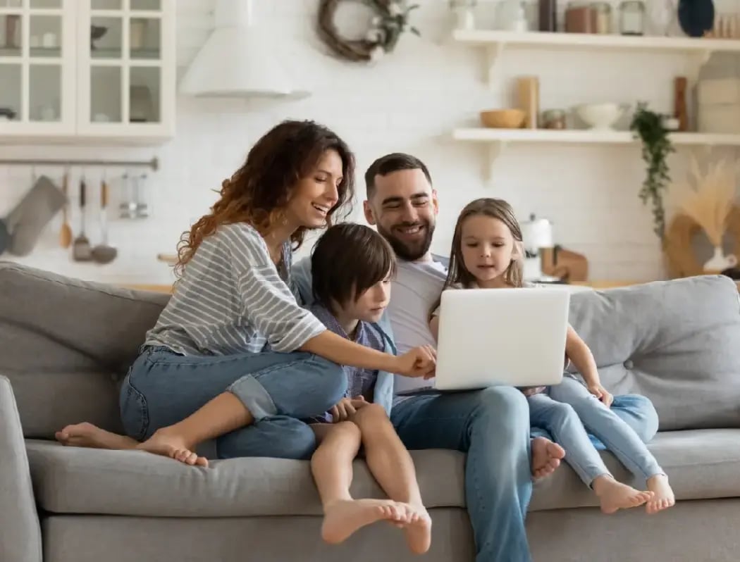 Family relaxing together on a couch